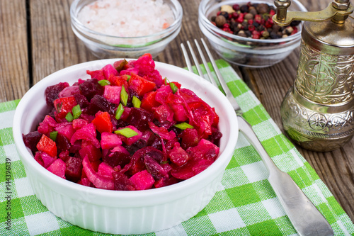Vegetable salad with beetroot in white salad bowl