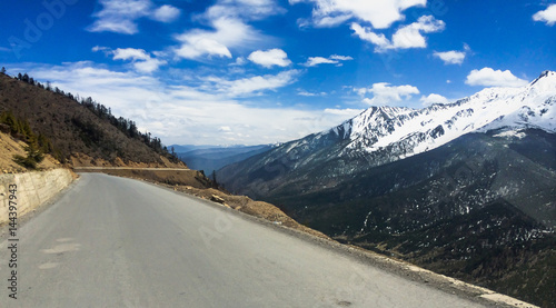 DEQIN, CHINA - APR 15 2015: The empty road to Deqin