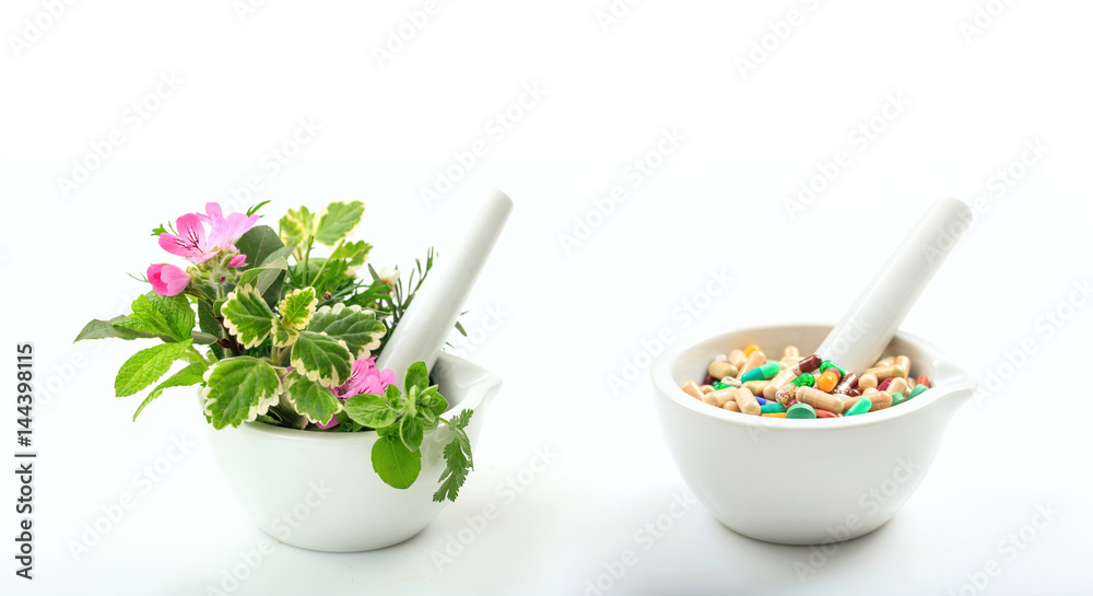 Alternative medicine concept - Herbs and pills in mortars on white background Alternative medicine concept - Herbs and pills in mortars on white background