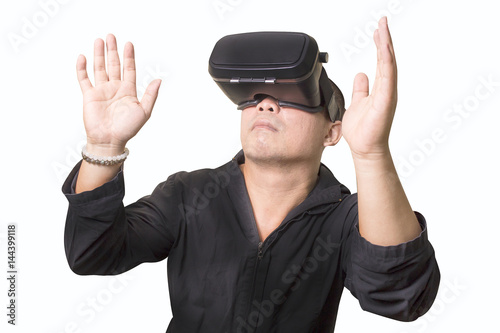 Excited man using a VR virtual reality glasses  headset and experiencing virtual reality isolated background