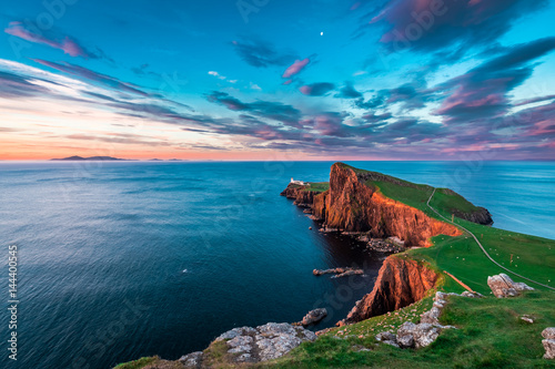 Famous dusk at the Neist point lighthouse in Scotland photo