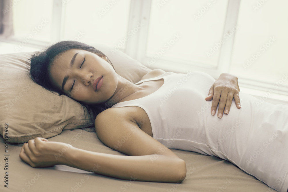 Asian cute woman deep sleep on bed in the morning, model is a asian beauty Asian cute woman deep sleep on bed in the morning, model is a asian beauty