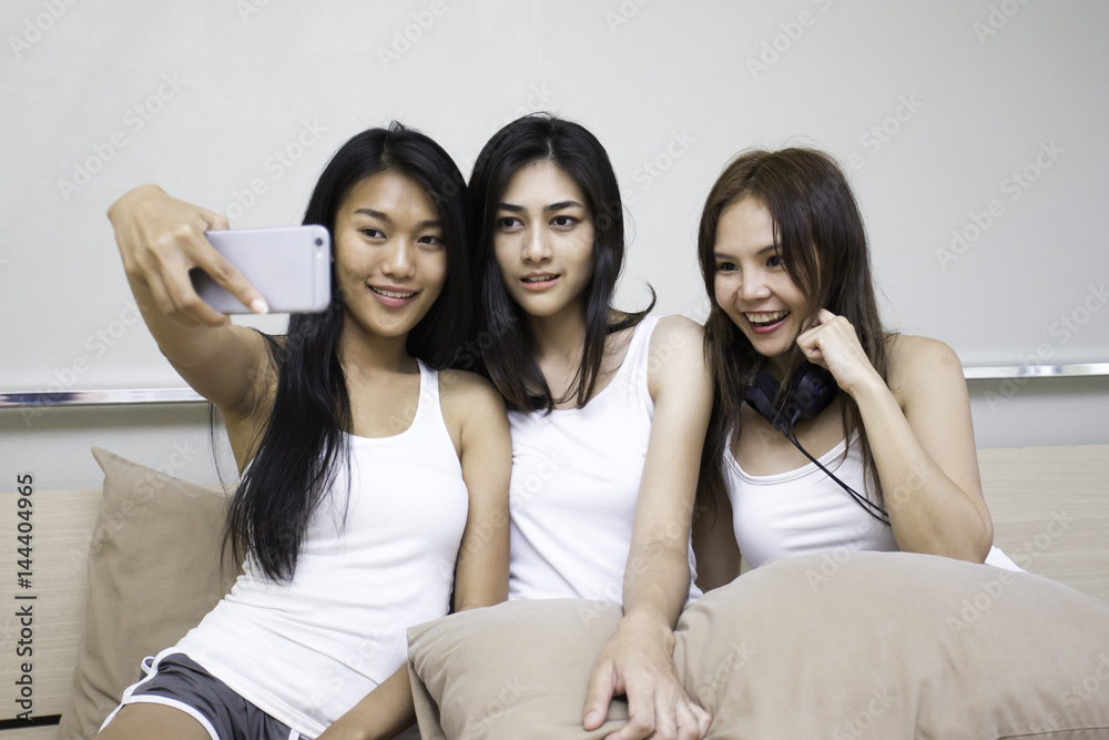 Close up portrait of beautiful asian woman use smartphone for selfie with attractive smiling together. Close up portrait of beautiful asian woman use smartphone for selfie with attractive smiling together.