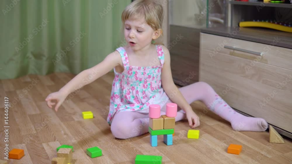 Little girl plays with a designer. 4k Little girl plays with a designer. 4k