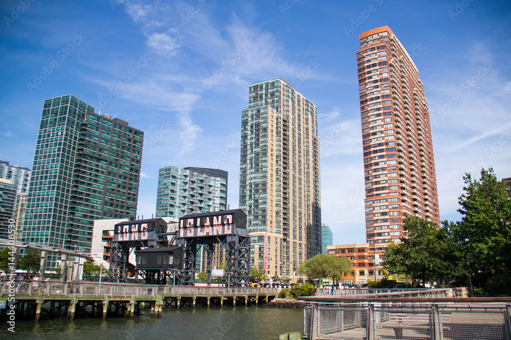 Pier at Gantry Plaza State Park and buildings with blue sky, New York
