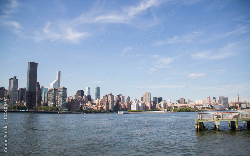 Buildings in Manhattan and the river with blue sky, New York