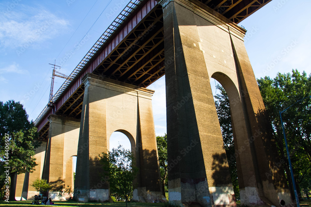 Structure under the Hell Gate Bridge with blue sky, Astoria park, New York Structure under the Hell Gate Bridge with blue sky, Astoria park, New York