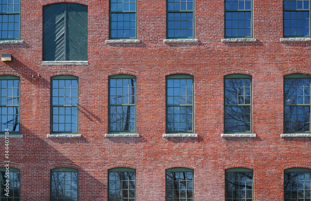 facade view of brick wall and window of old factory building