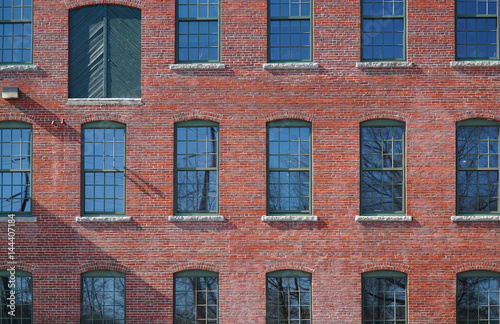 facade view of brick wall and window of old factory building