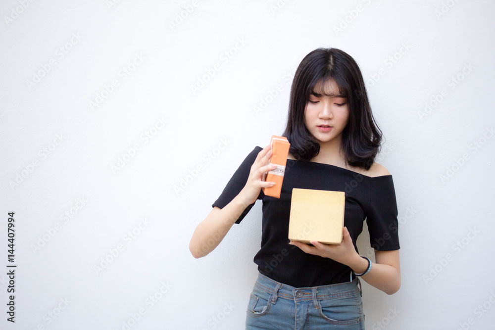 Portrait of thai vietnam teen beautiful girl hold gift box in hands Portrait of thai vietnam teen beautiful girl hold gift box in hands