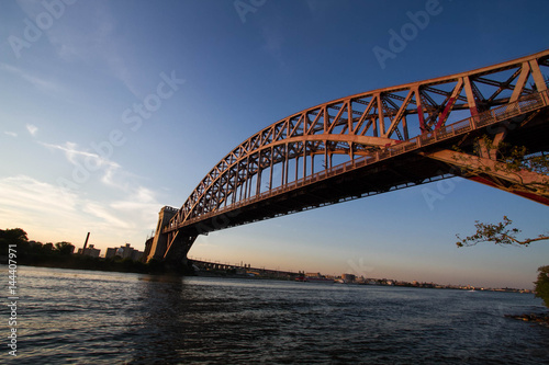 The Hell Gate Bridge over the river with sunset sky, New York © Spinel