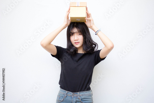 Portrait of thai vietnam teen beautiful girl hold gift box in hands