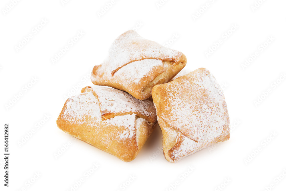 Cookies of puff pastry topped with powdered sugar isolated on white