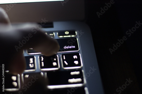 close hand on key pad and blur background photo