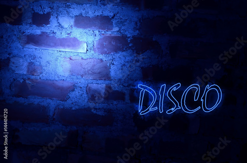 disco text in brick wall