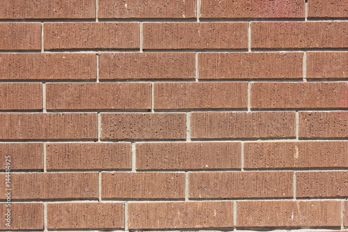 a wall of brown bricks