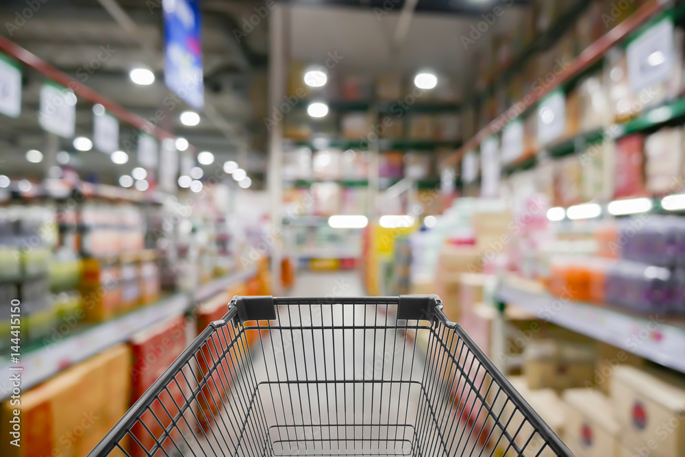 Abstract blurred photo of store with trolley in department store bokeh background,Shopping cart in supermarket and Home Hardware and furniture Stores
