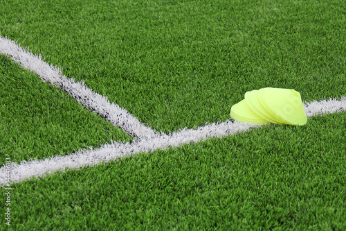Chips on an artificial lawn with markings on a football field. Sports background.