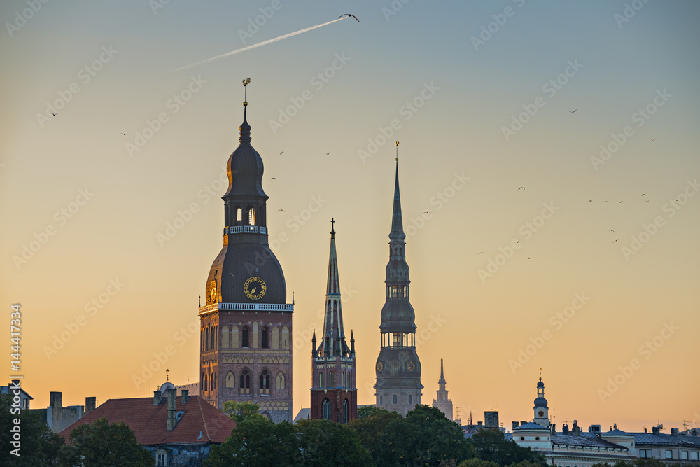 Morning silhouettes of old Riga - the capital of Latvia and famous Baltic city widely known due to its unique medieval and Gothic architecture
