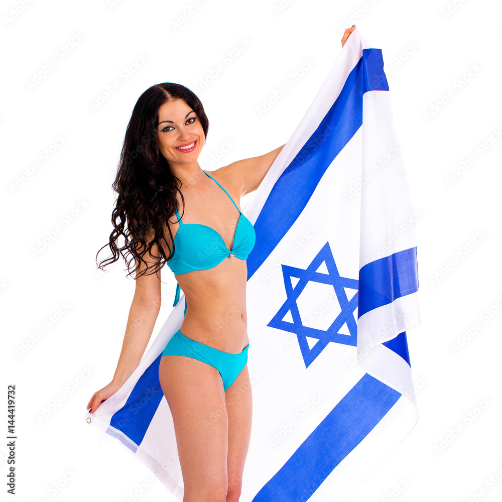 Young beautiful brunette woman in blue bikini holds up a clear flag of  Israel Stock Photo | Adobe Stock