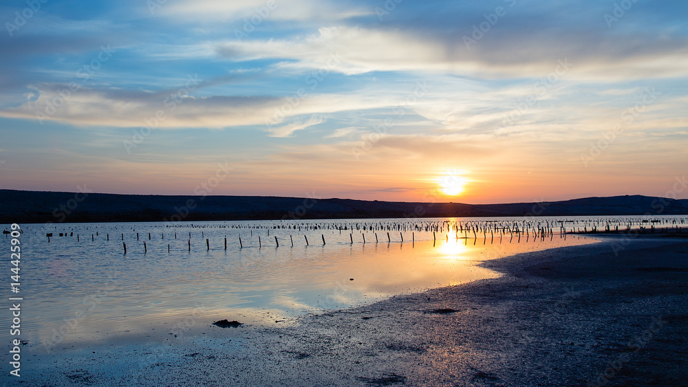 Obraz premium Antique Saline with beautiful sunrise - sea landscape - Salt production field