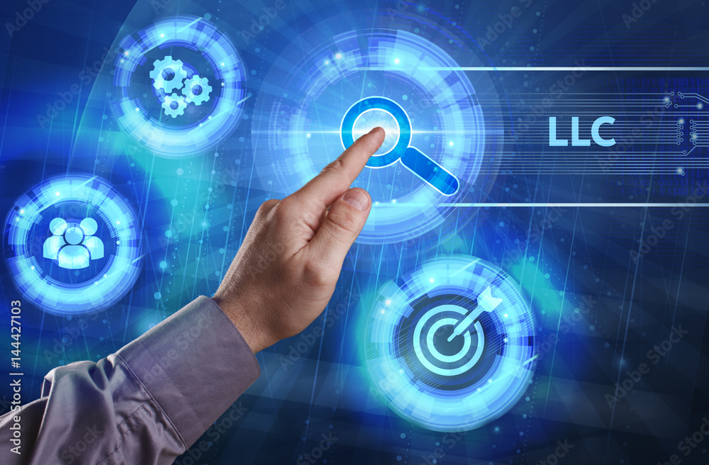 Business, Technology, Internet and network concept. Young businessman working on a virtual screen of the future and sees the inscription: LLC Business, Technology, Internet and network concept. Young businessman working on a virtual screen of the future and sees the inscription: LLC