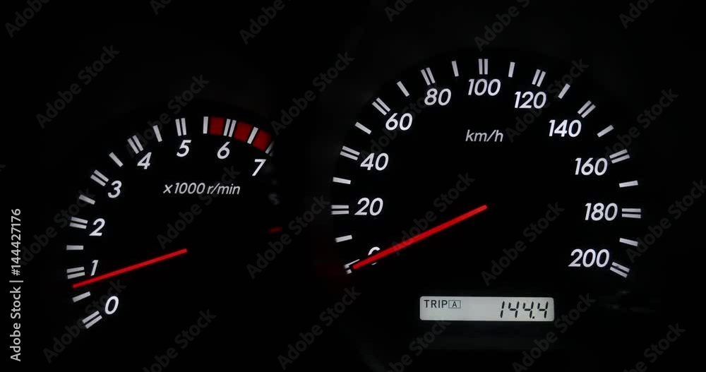 Close up of car dashboard and Odometer,Revving Speedometer and Tachometer Close up of car dashboard and Odometer,Revving Speedometer and Tachometer