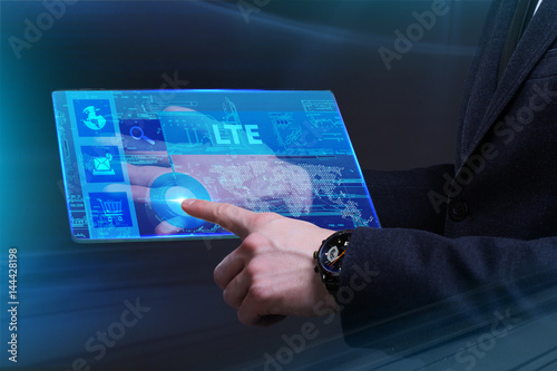 Business, Technology, Internet and network concept. Young businessman working on a virtual screen of the future and sees the inscription: LTE
