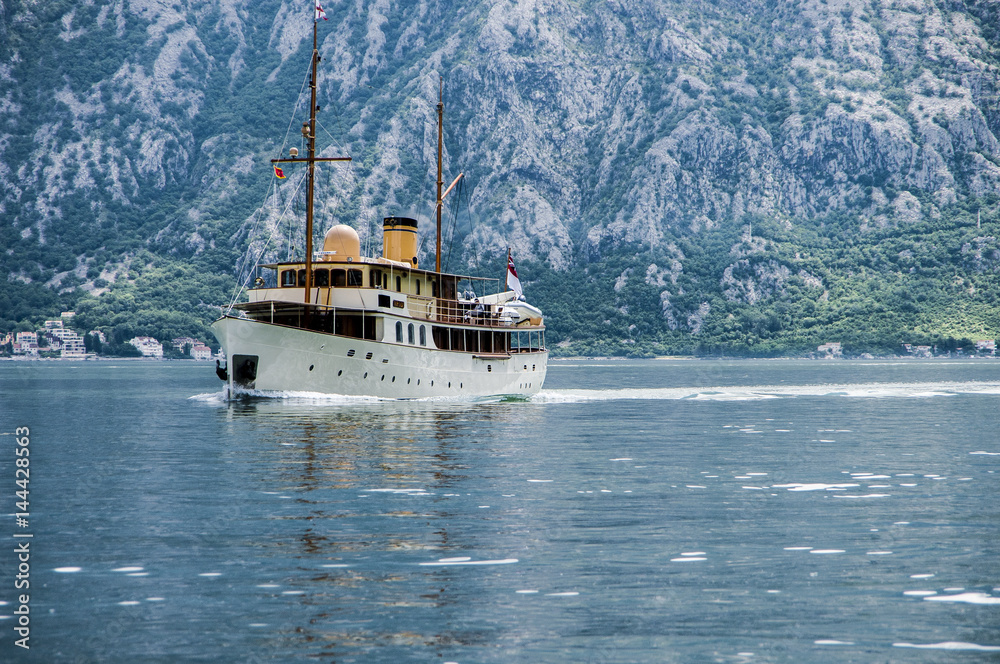 Ship in the sea against the background of mountains