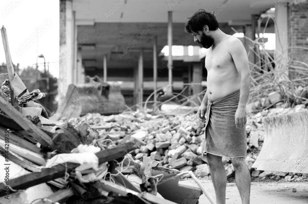 Young homeless man half naked staring at pile of rubbish Stock Photo |  Adobe Stock