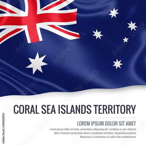 Flag of Australian state Coral Sea Islands Territory waving on an isolated white background. State name and the text area for your message. © adaptice