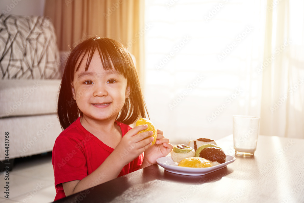 Asian Chinese little girl having breakfast