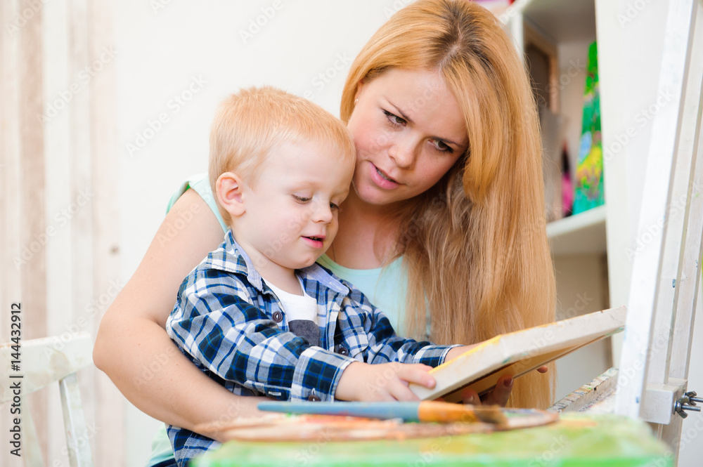Mother and child draw a picture paints, art lesson Mother and child draw a picture paints, art lesson