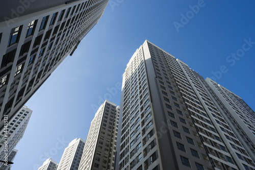 Resident apartment buildings against blue sky