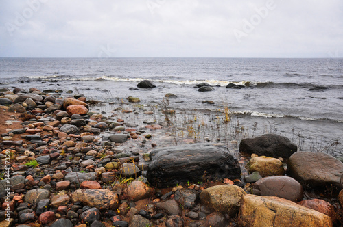 Stones on the shore of stormy waving Ladoga lake. Priozersk, Russia