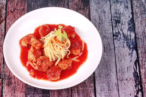Meatballs linguine pasta with tomato sauce.