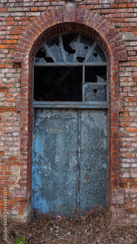 Picture of old, destroyed door with broken window. Picture of old, destroyed door with broken window.