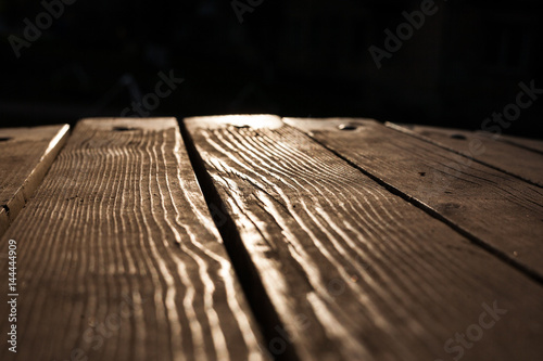 Wood floor texture. Wooden planks on a background of sunlight photo