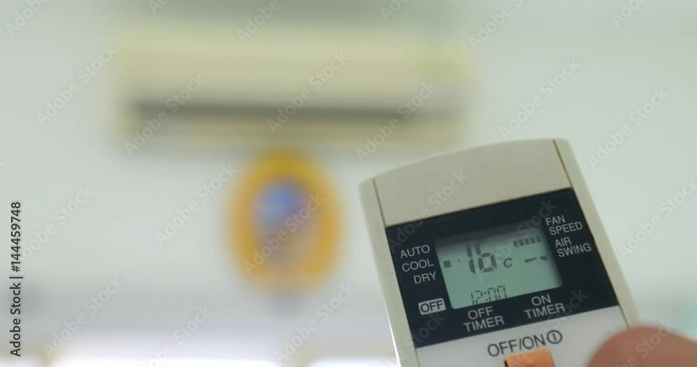Cooling down room by changing temperature on air conditioner 4K 2160p UHD video - Changing room temperature with AC remote controller 4K 3840X2160 UHD footage Cooling down room by changing temperature on air conditioner 4K 2160p UHD video - Changing room temperature with AC remote controller 4K 3840X2160 UHD footage
