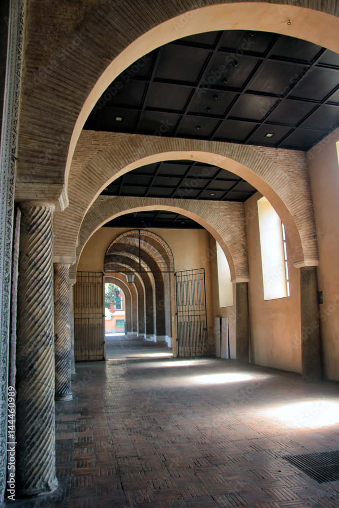 medieval arched hallway with brick arches