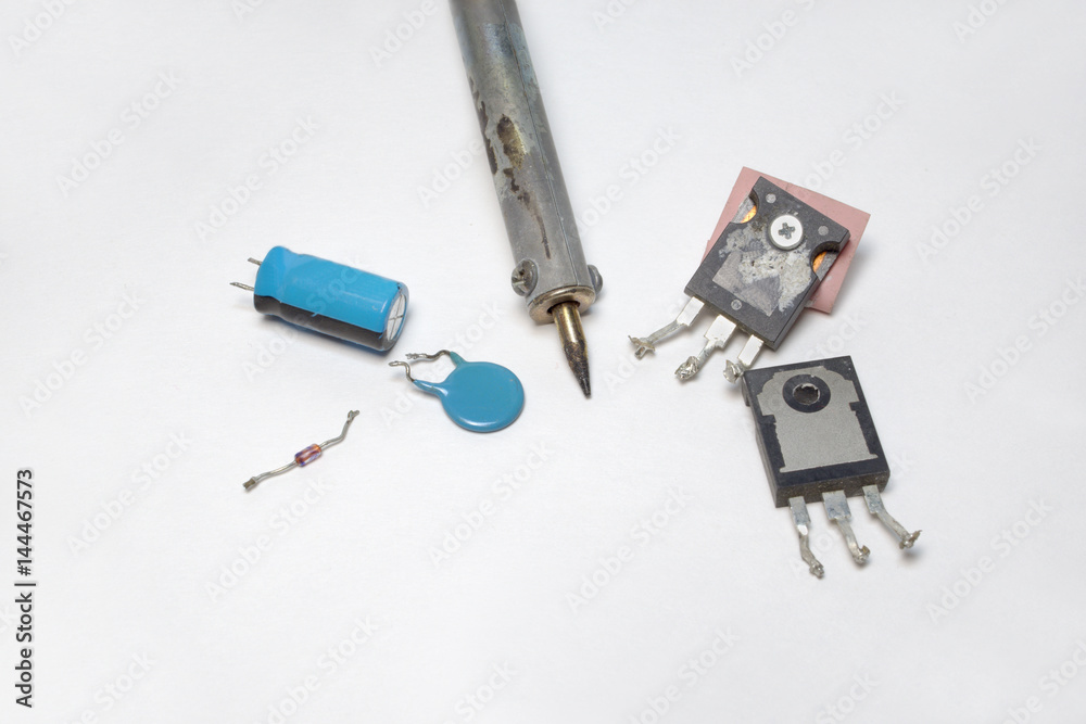 Set of electronics: transistors, capacitors, diode and soldering tip Set of electronics: transistors, capacitors, diode and soldering tip
