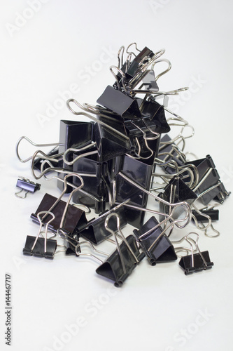 metal binder clips for paper. Blacks  different sizes. Vertical hill