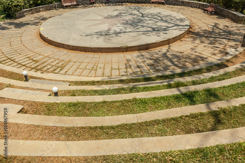 Narrow view of circular concrete steps in a green garden, Chennai, India, April 01 2017