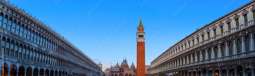 Evening wide angle panoramic view of Piazza San Marco with the Basilica. Venice, Italy.