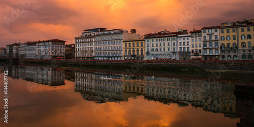 A kayaker paddles through the Arno River