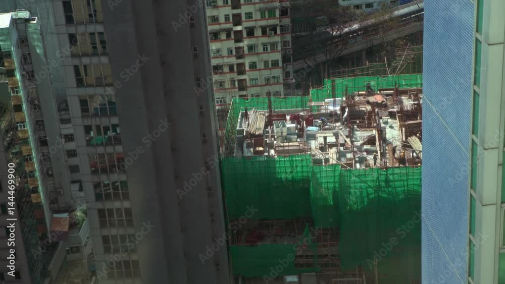 4K Aerial View Of Construction Industry Workers Working with Bamboo On Building Structure at Downtown of Hong Kong City Center Buildings. Above cityscape of capital daytime-Dan 4K Aerial View Of Construction Industry Workers Working with Bamboo On Building Structure at Downtown of Hong Kong City Center Buildings. Above cityscape of capital daytime-Dan