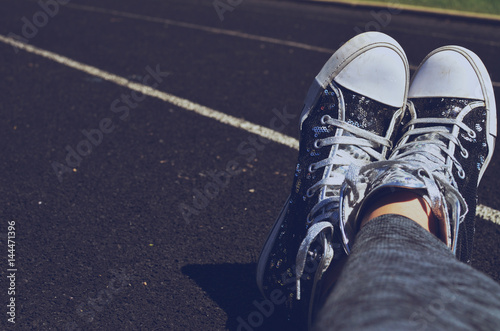 Slika na platnu Casual sequin shoes sparkle outside, on active person's feet for walking
