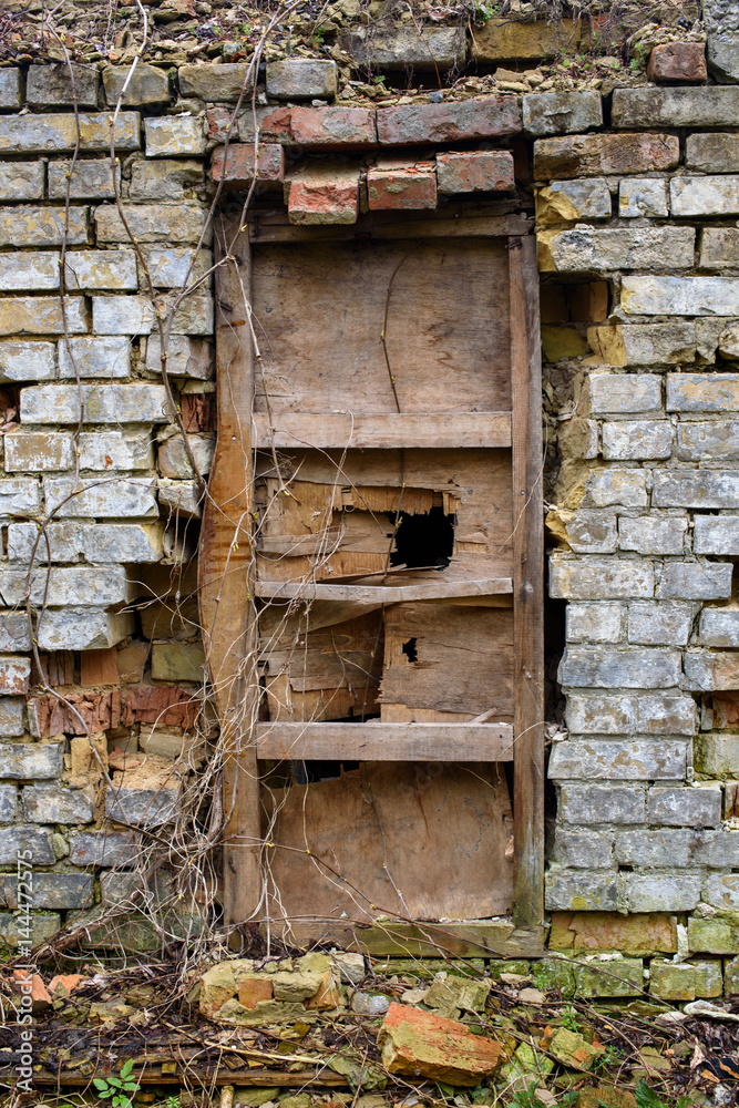 Old Broken door in the abandoned ruined building Old Broken door in the abandoned ruined building