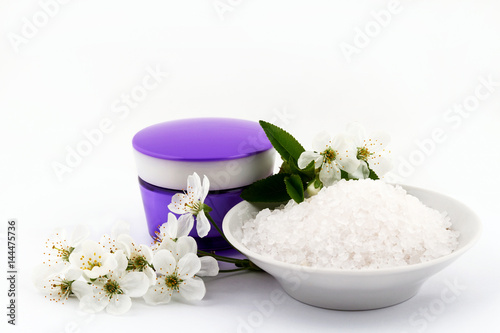 Cosmetic sea salt on a white background, products for face and body care 