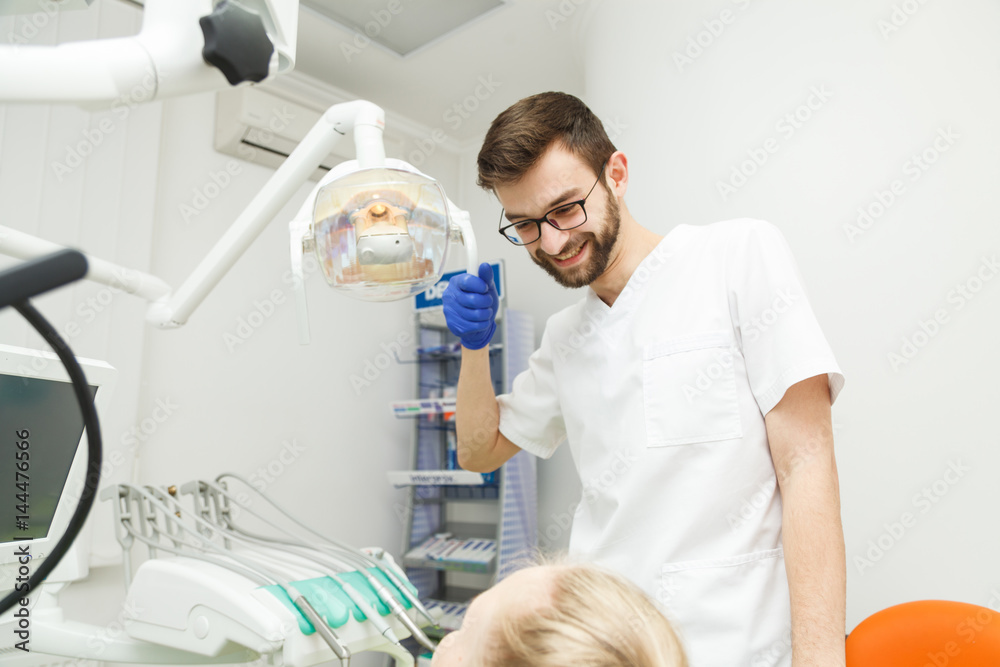 Male dentist and his patient